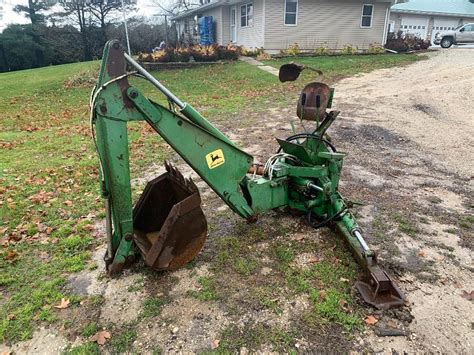 john deere skid steer backhoe|john deere 165 backhoe attachment.